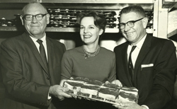 Sam Coates, unknown woman, and Roy Bertrand Sr., at a restaurateur's function.